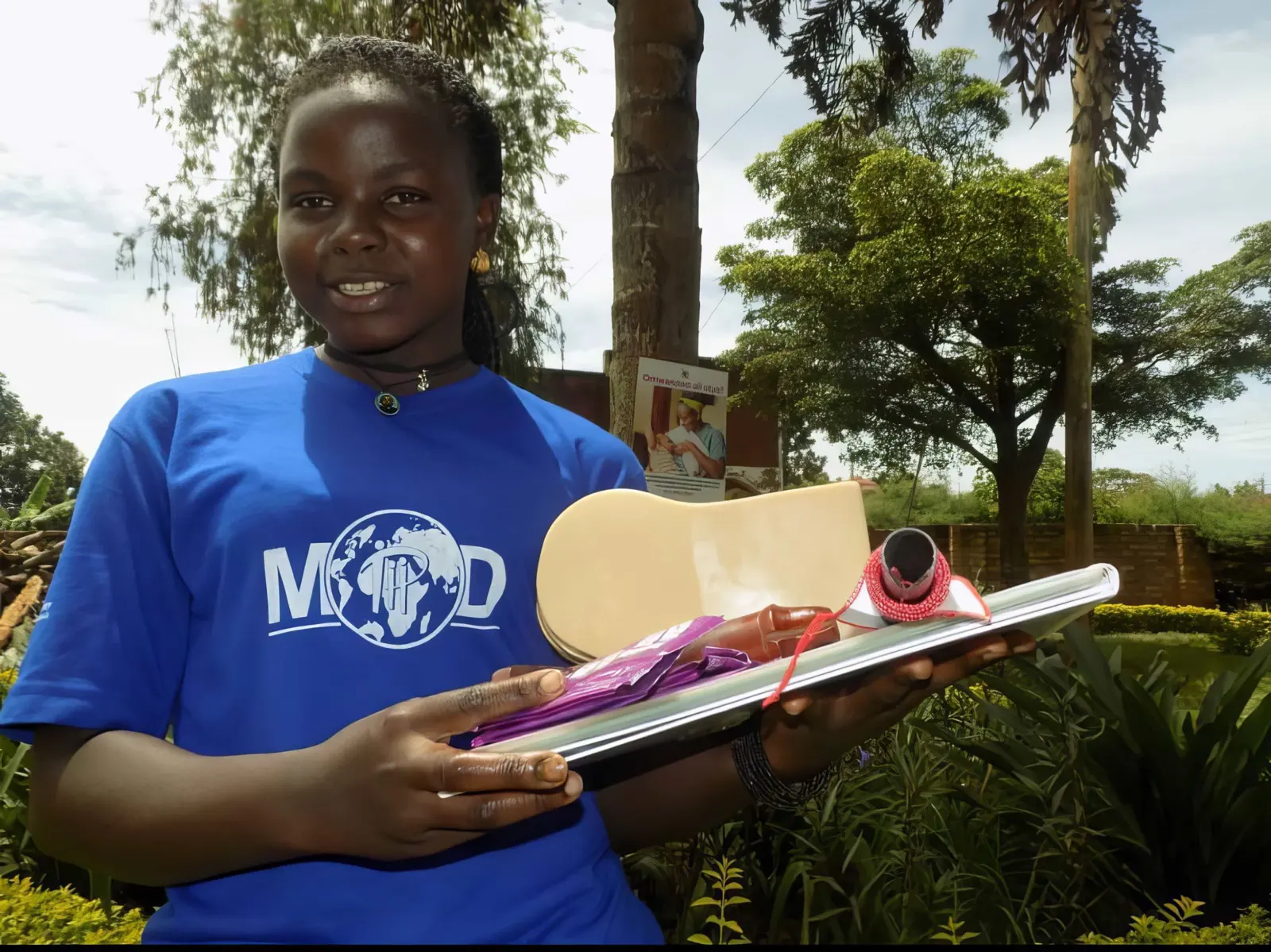 A young woman in a MOD T-shirt at a community outreach